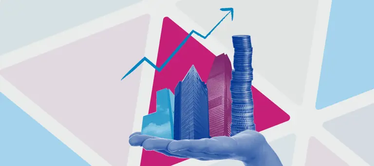 Hand holding skyscrapers and a pile of coins