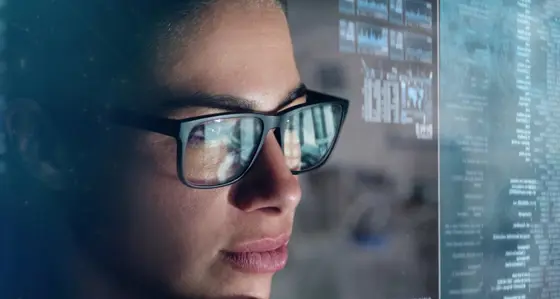 A woman looking at a computer screen