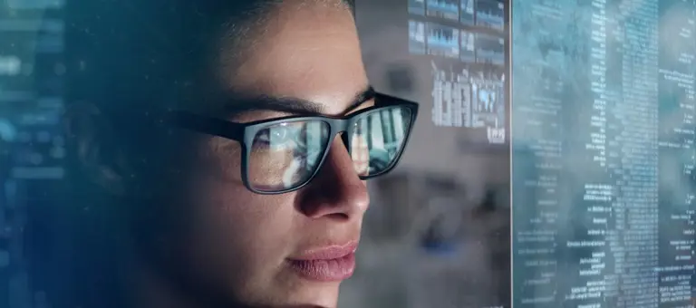 A woman looking at a computer screen