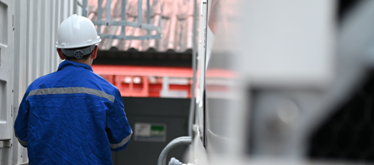 Engineer conducts inspection at industrial plant