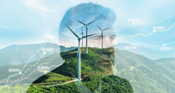 A man's head and index prices superimposed over a green hillside with a wind turbine