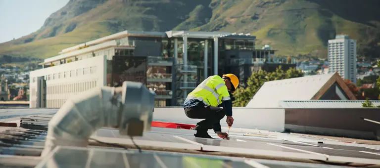 Worker on a solar panel