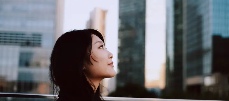 Woman looking at skyscrapers