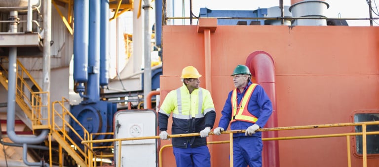 Two men on an oil rig