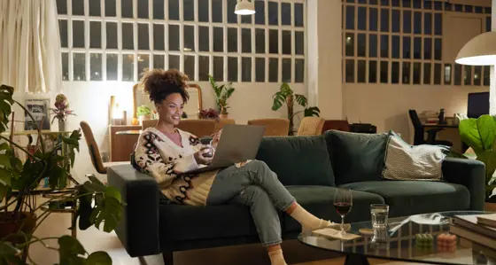 Woman working on a laptop at home