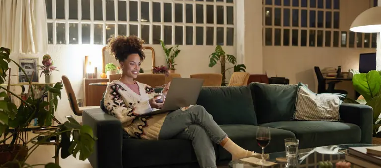 Woman working on a laptop at home
