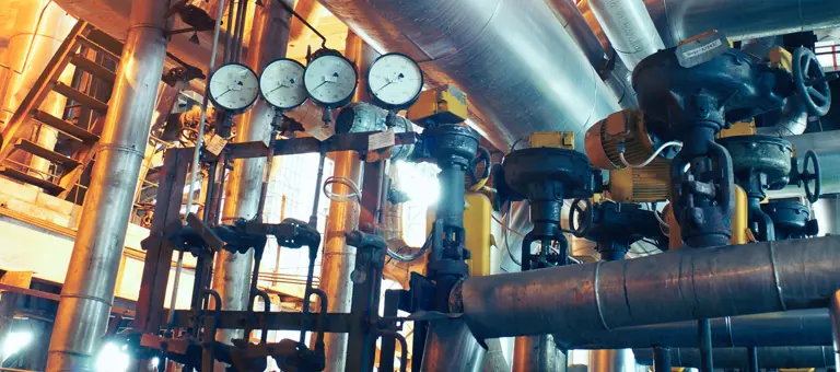 Pressure gauges and pipes inside a factory