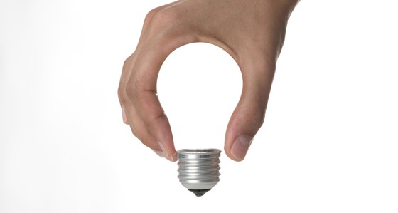 A hand making a light bulb shape