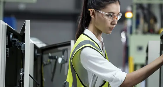 A woman carrying out equipment maintenance
