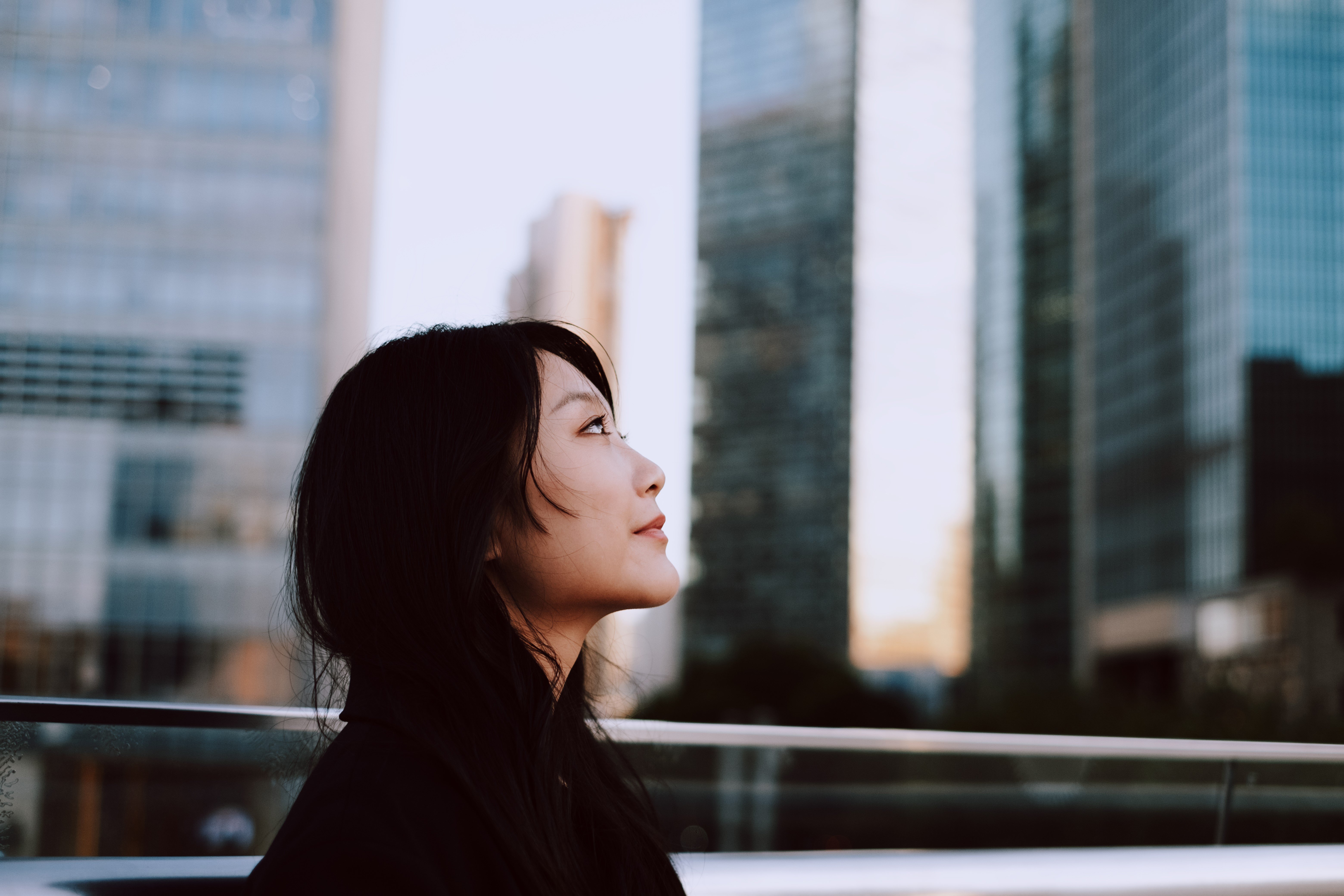 Woman looking at skyscrapers