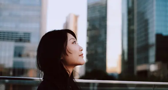 Woman looking at skyscrapers