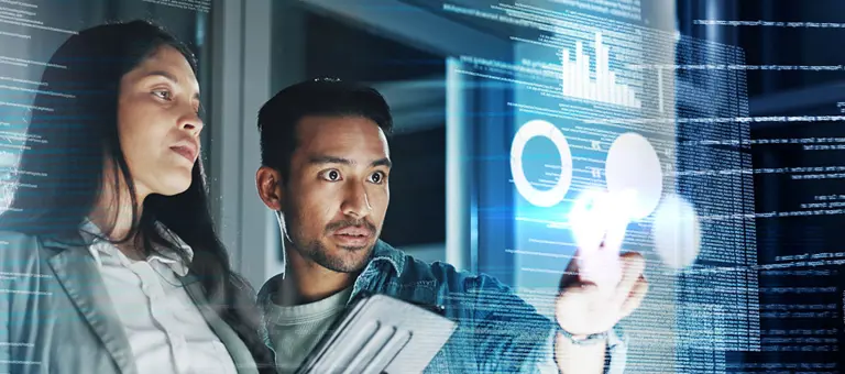 Two colleagues looking at a screen