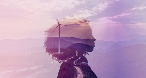 Woman outline on a wind farm background