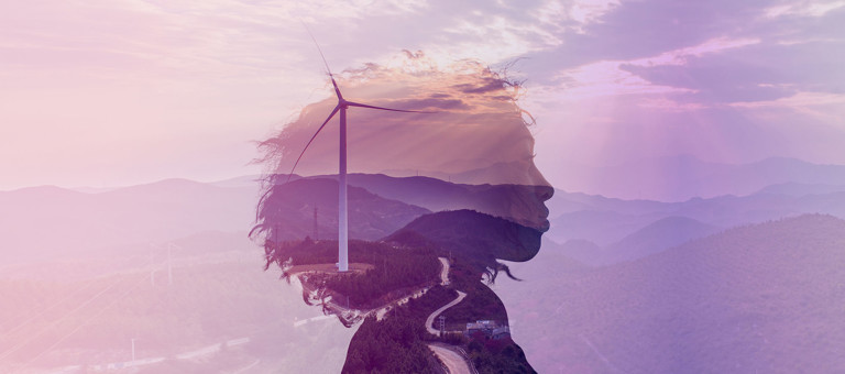 Woman outline on a wind farm background