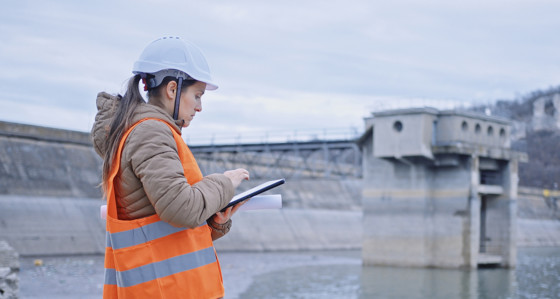 Woman inspecting a water facility
