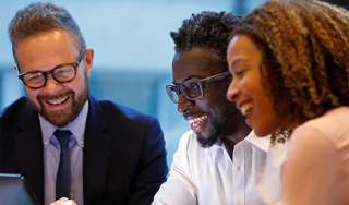Business people laughing during a meeting