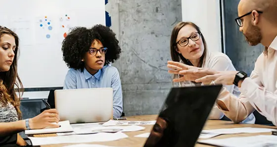 A group of people in a meeting