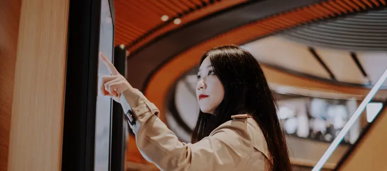 Woman touching a screen