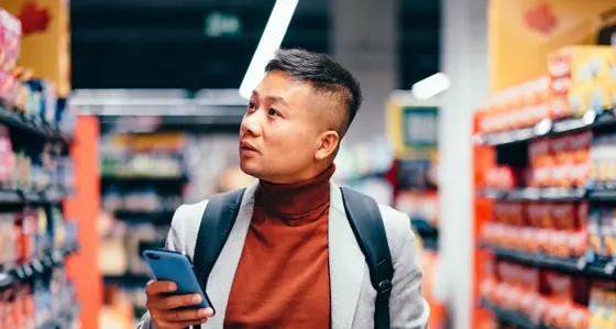 Man looking at shelves in a supermarket
