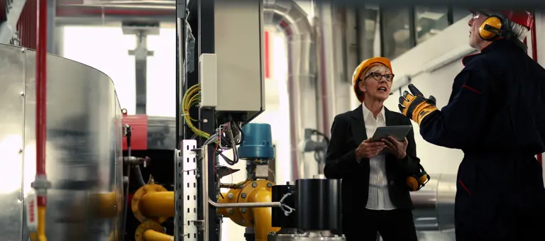 A woman and a man in a factory