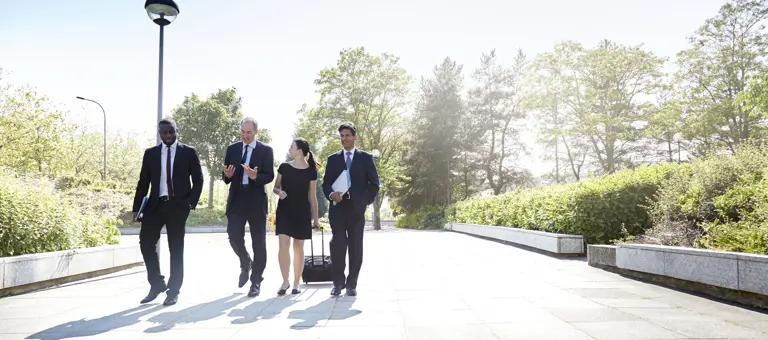 business people walking outdoors