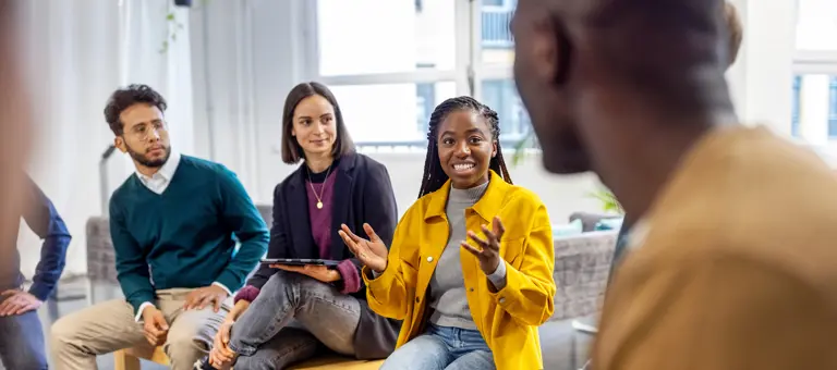 Group of diverse people having a discussion at work