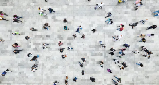 lots of people walking on concrete