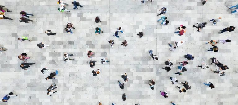 lots of people walking on concrete