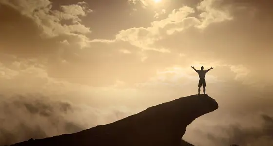 Man on top of a cliff