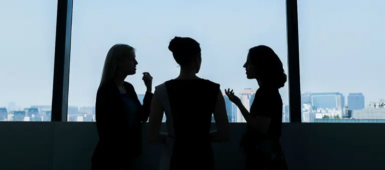 Group of women having a conversation in an office