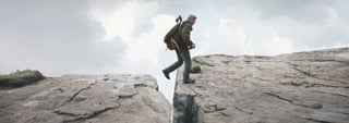 Man jumping between rocks