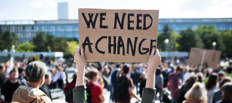 Climate activist with placard