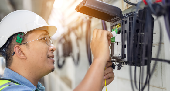 Engineer inspecting a cable box