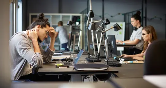 Male entrepreneur looking at laptop