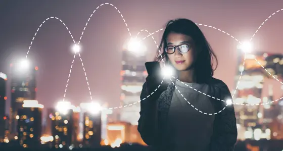 A woman with her phone and graphical overlay