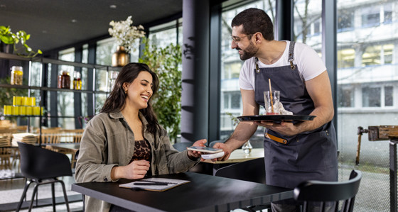 Woman paying in a cafe