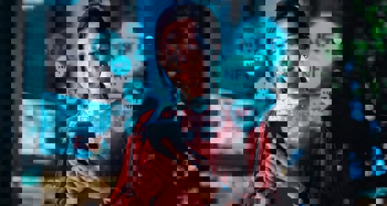 A woman looking at smart phone with an overlay of NFT logos