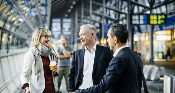 Professionals meeting at a train station