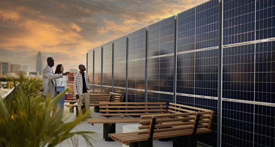 Prospective Buyers Admiring Solar Energy System on a city rooftop