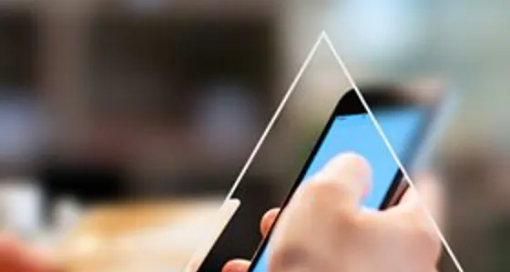 Looking a triangle to see a phone with rest of the image blurred