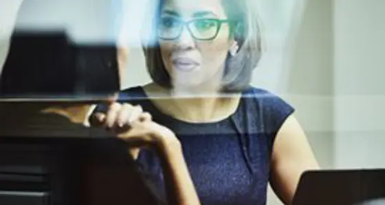 Two women in conversation with a laptop
