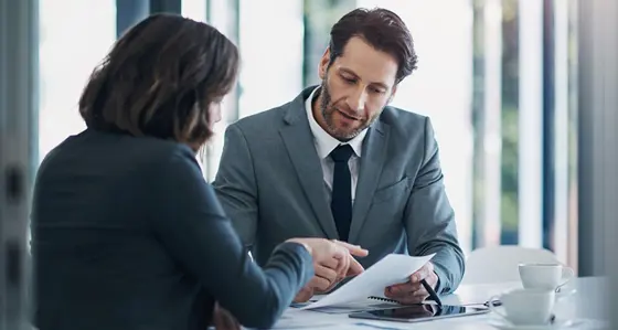 Two business people reviewing a document