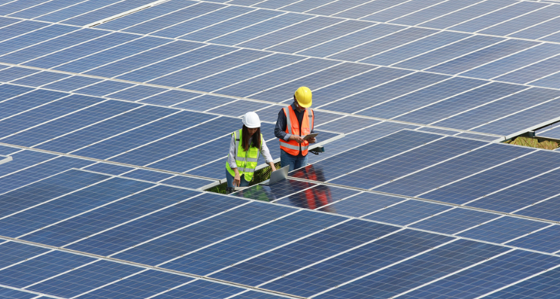 Workers working on solar panels