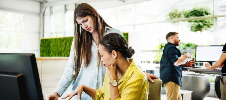 A modern Office Space With Employees Working At Desks