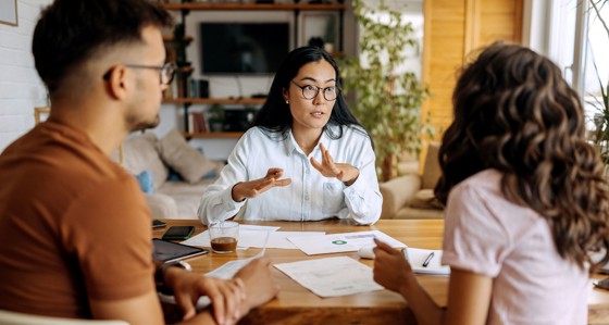 Young couple getting advice from financial expert