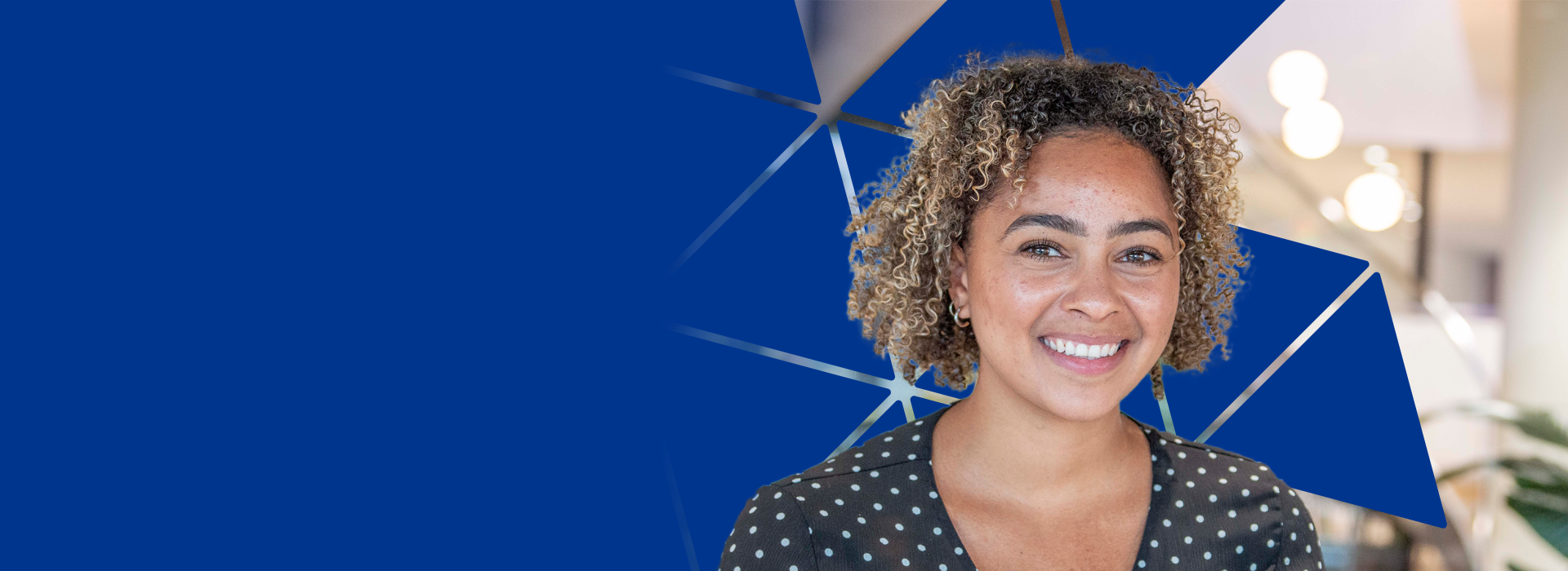 Female employee with logo background