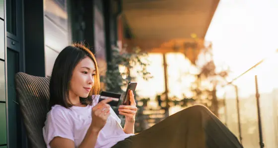 Woman online banking on mobile phone