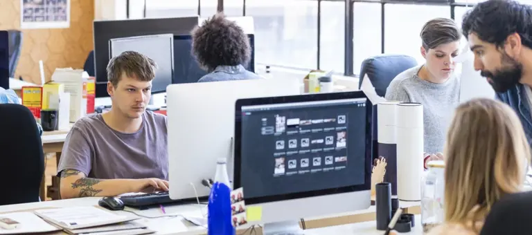 People sitting at their computer workstations