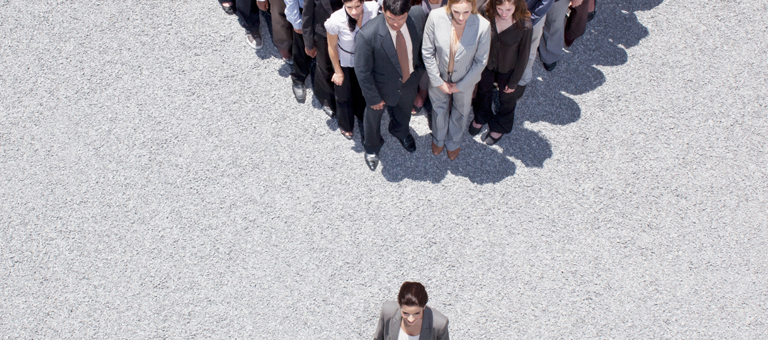 An aerial view of a group dressed in suits