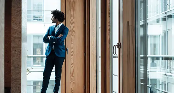 Standing man by the window
